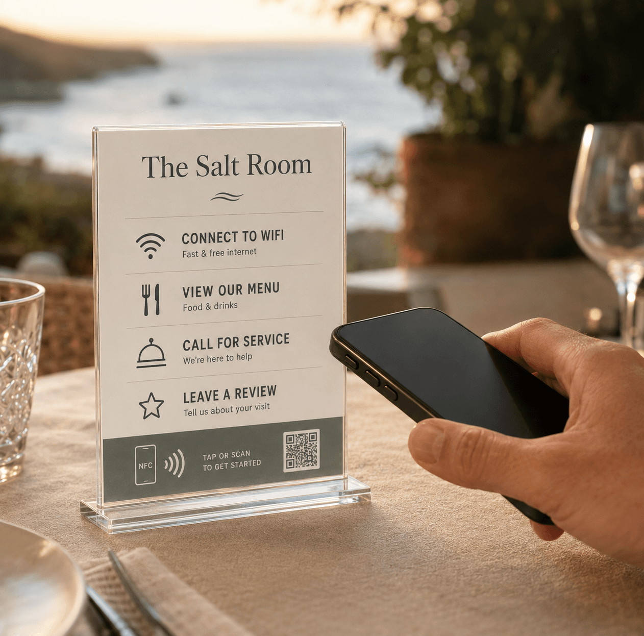 A guest tapping a phone on a GuestWave talker